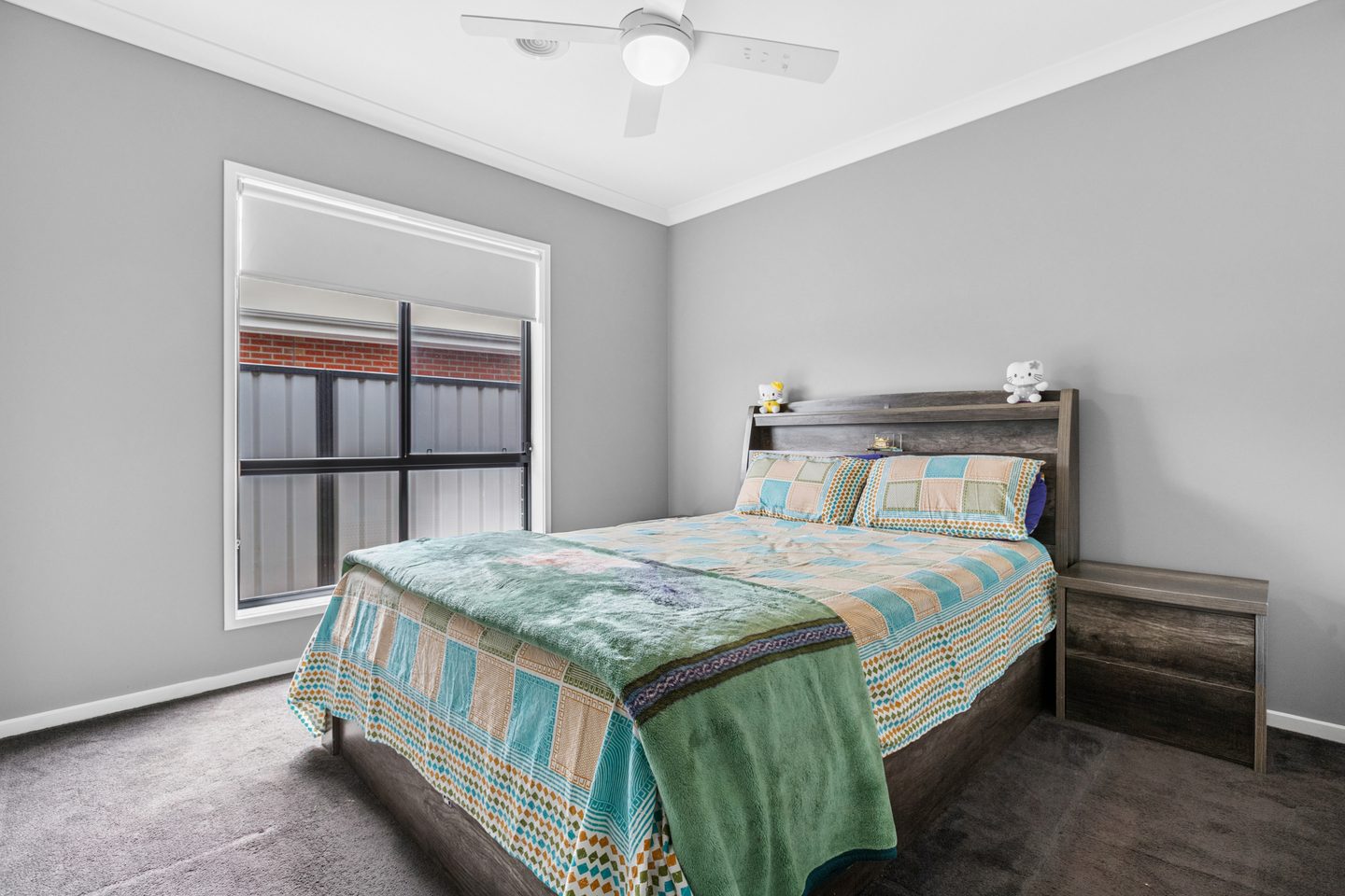 Bedroom with ceiling fan and carpet