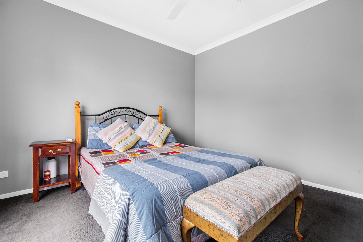 Carpeted bedroom with soft grey walls