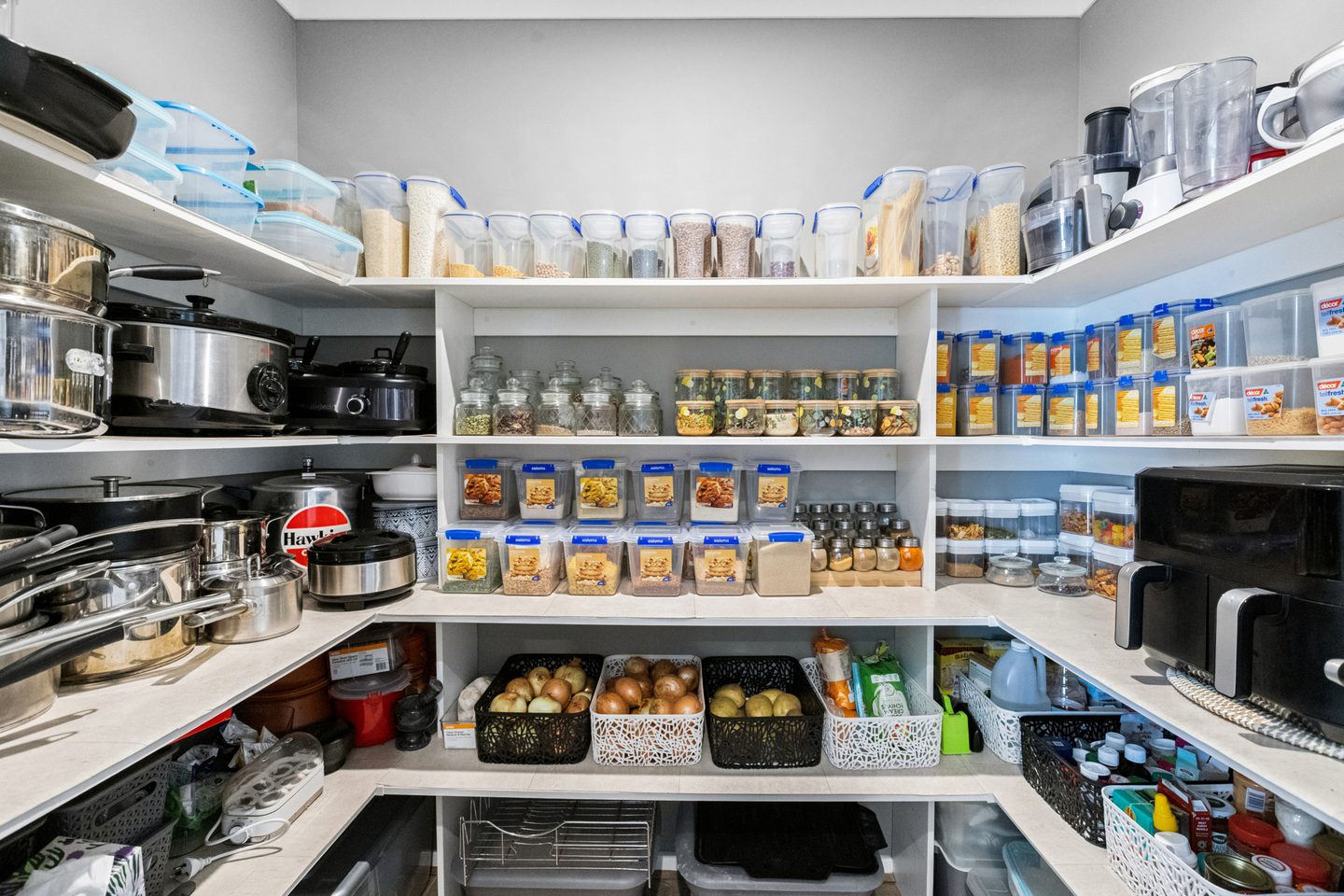 Wraparound shelving in the walk-in pantry