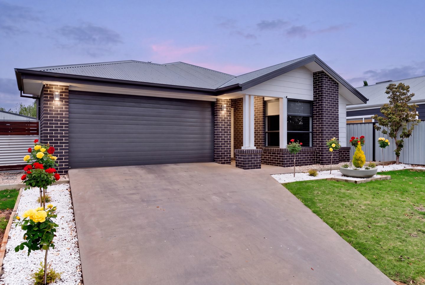 Garage and front entrance at dusk
