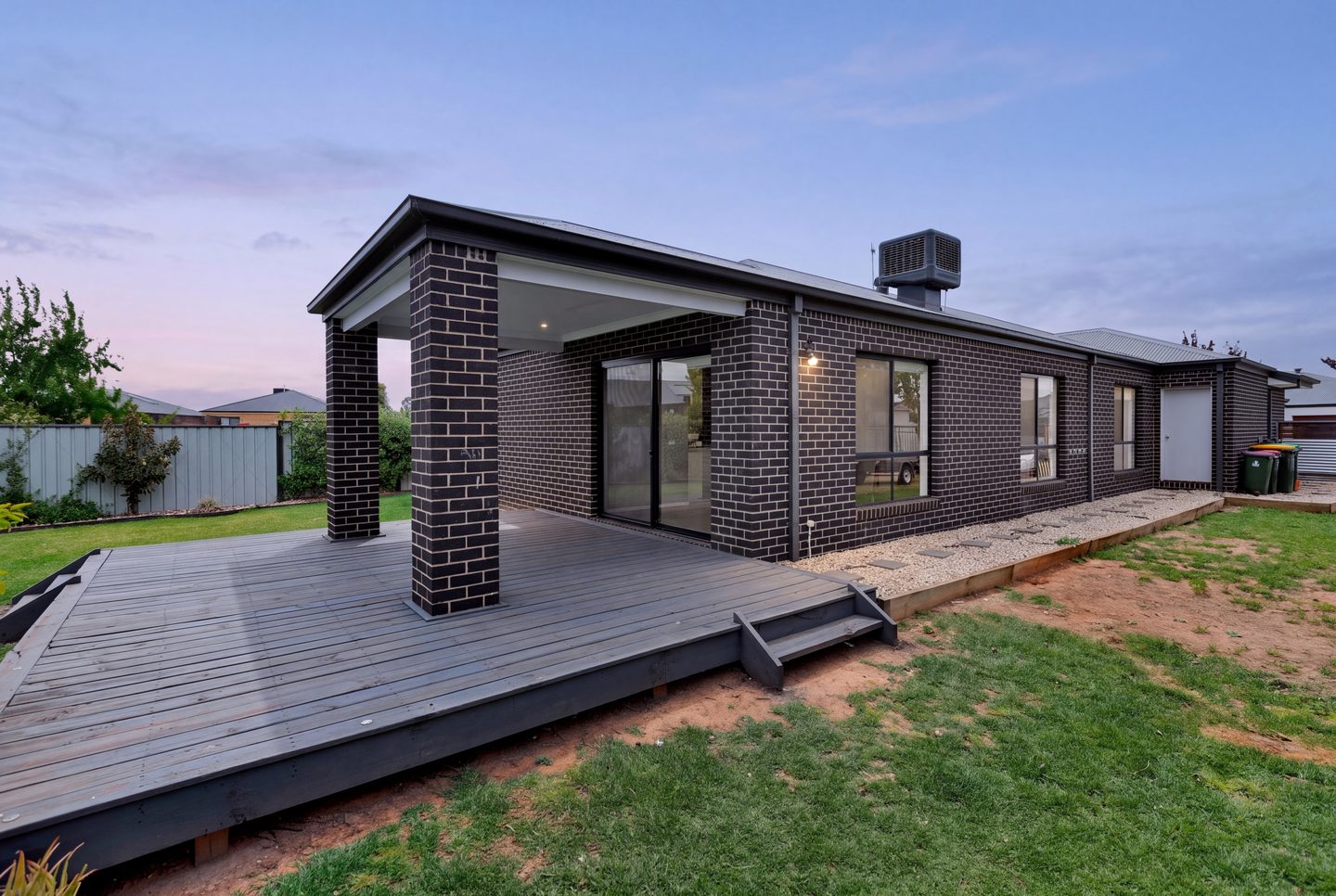 Deck and rear of the home at dusk