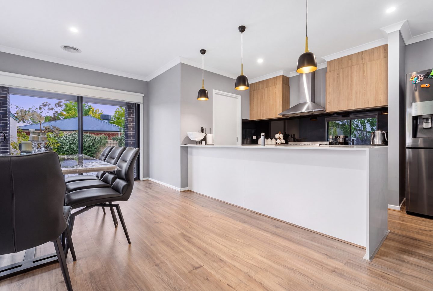 Kitchen and island with pendant lighting
